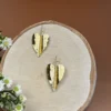 Golden-Leaf-earrings-crafted-in-18k-gold-plated-bronze-with-a-central-chain-that-highlights-their-natural-and-sophisticated-structure